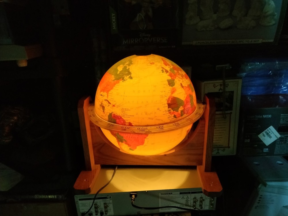 Sunlit Motorized Daylight-Illuminated Rotating 12” World Globe Clock w/Oak Stand