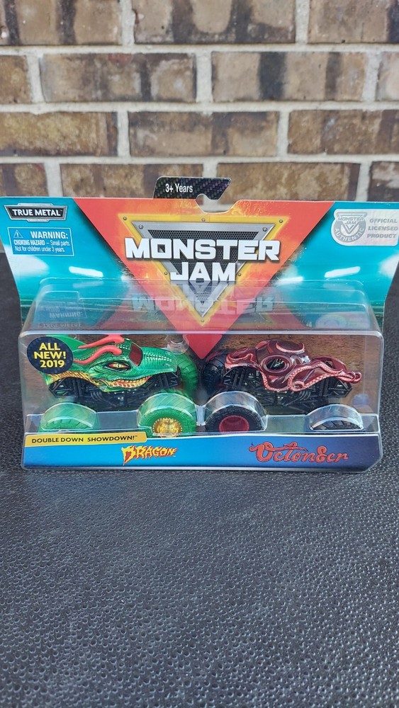 Spin master Monster Jam double down showdown dragon w/ Gold Rims Vs Octonber