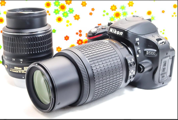Nikon D5100 DSLR Camera with Dual Lenses and Smartphone Connectivity