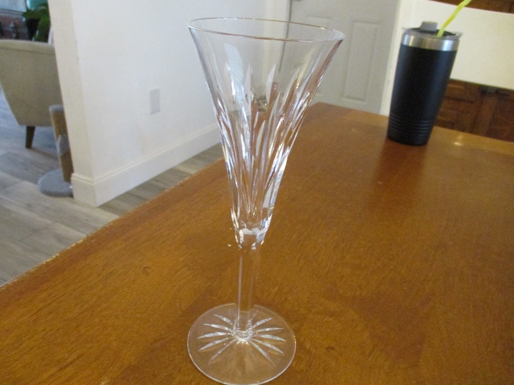 Waterford Crystal fluted champagne glass with signed logo 9 inches tall