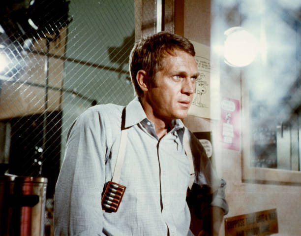 Steve McQueen wears gun holster in police station in the 1968 thri- Old Photo