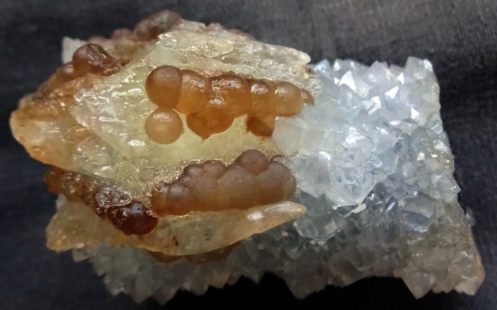Stunning fluorite balls with calcite crystal on quartz base mineral specimen