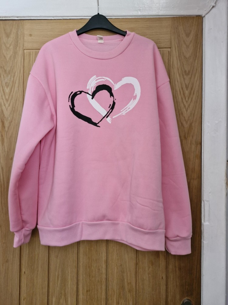 Pink heart print fleece-lined oversized sweatshirt in size 16/18