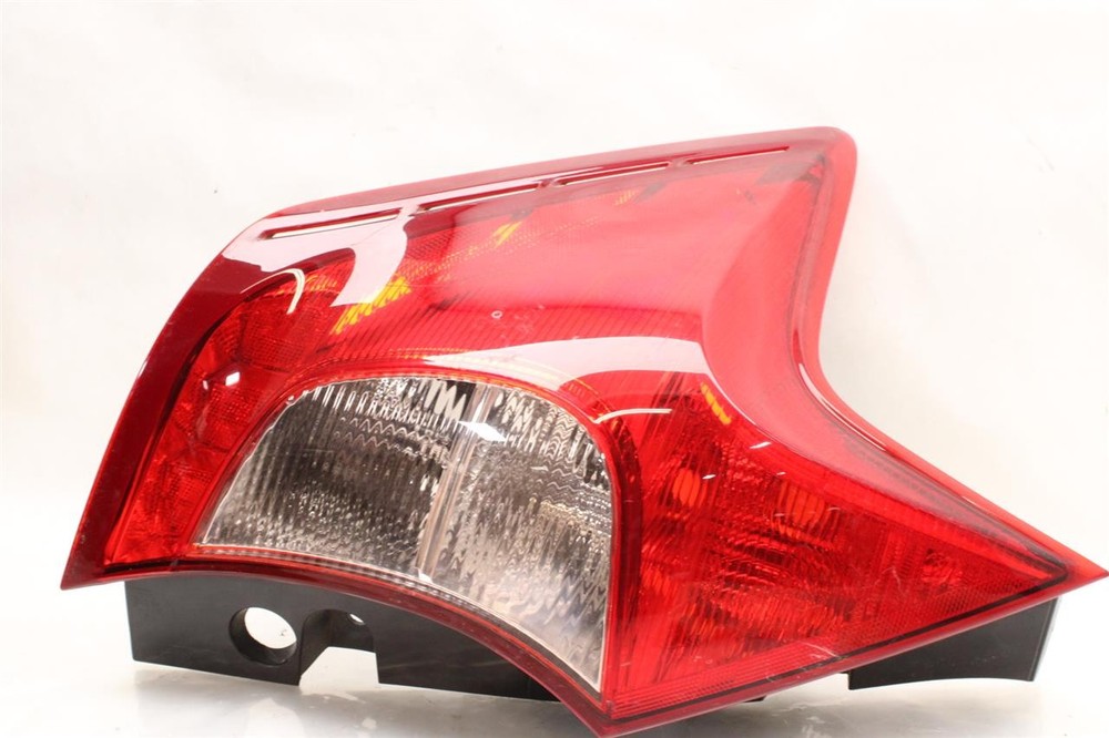 Used Left Tail Light Assembly fits: 2018 Nissan Versa quarter panel mounted Htbk