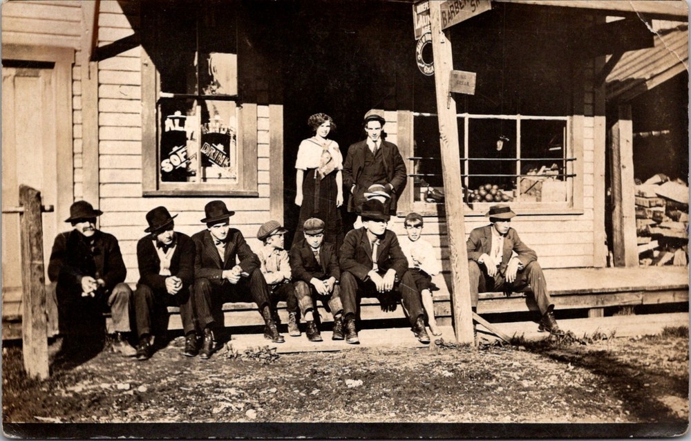 RPPC Postcard Men and Woman on Porch of Local General Store c.1907-1914    12556
